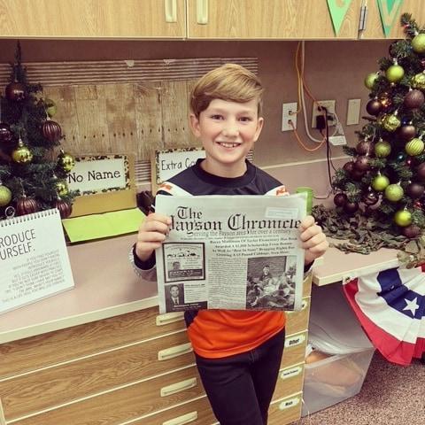 Rocco holding article from Payson Chronicle 